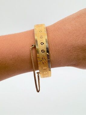 Vintage Gold Tone Hinged Bangle Bracelet with Safety Chain